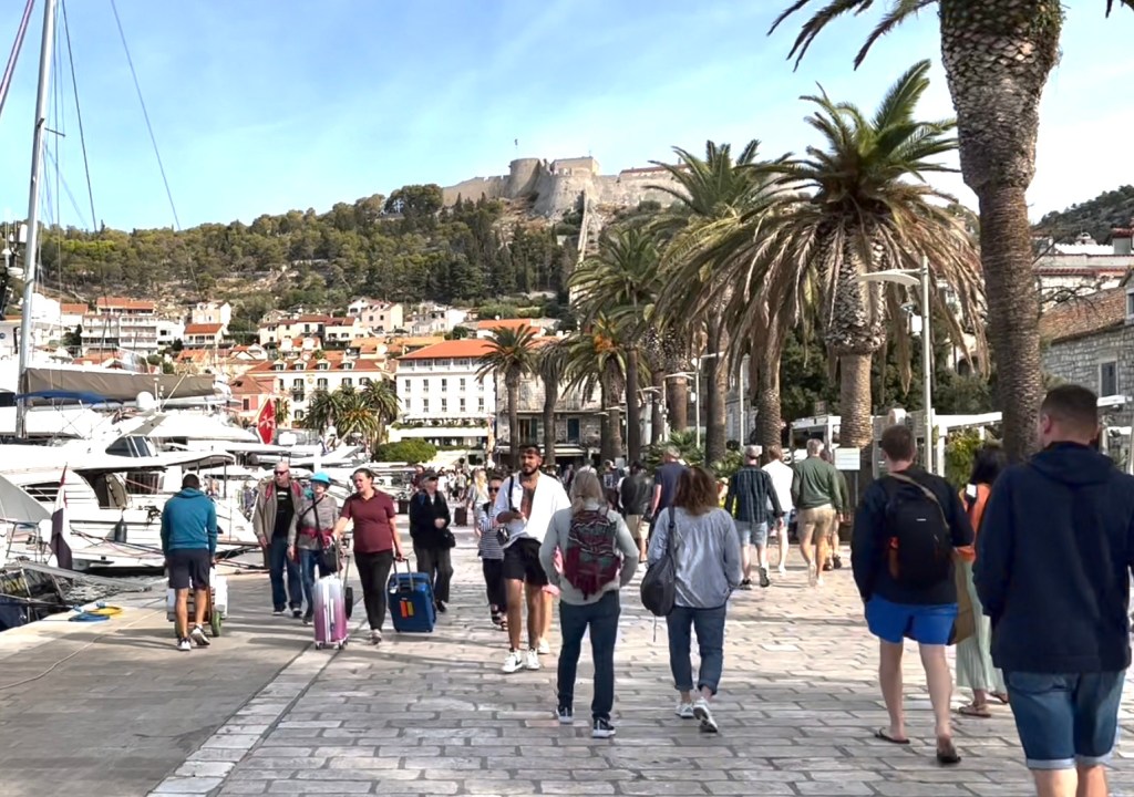 Walking along the harbor in Hvar town, an island in Croatia.